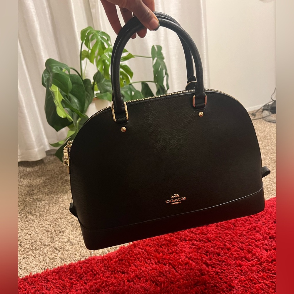 Coach black handbag with shoulder strap. New with tags. Never used.